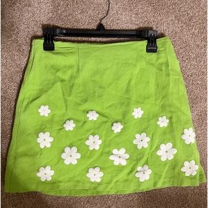 green mini skirt with white flowers! size small/medium!